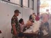 Babinsa Proppo Dampingi Pendistribusian Beras Bulog, Warga Diimbau Jaga Kerukunan